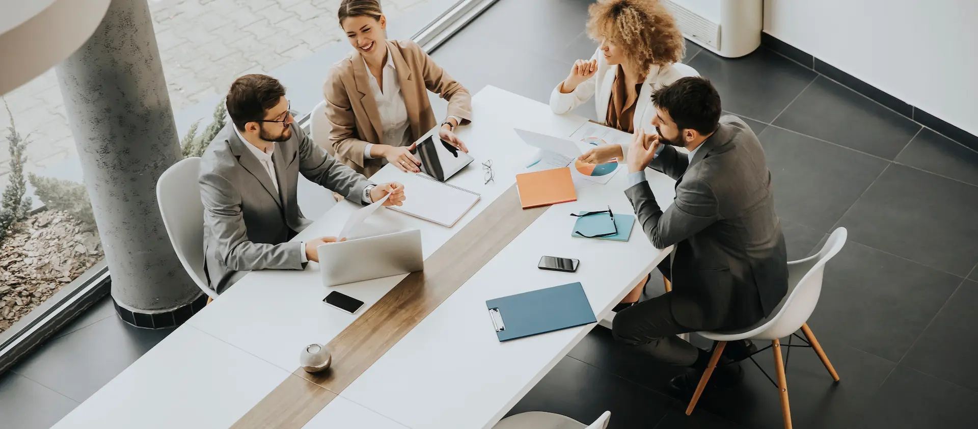 Two women and two men sitting in a meeting together